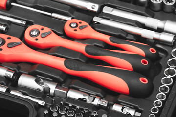 Fototapeta premium A toolbox with many different tools including pliers, wrenches, and screwdrivers. tools are organized in a way that makes it easy to find what you.