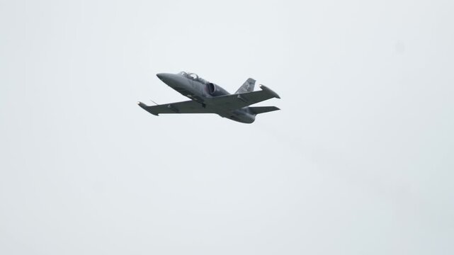Majestic flight of Aero L-159 Alca soaring through cloudy skies
