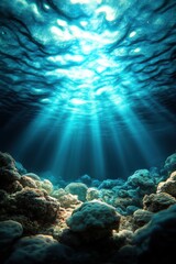 Obraz premium Sunlit underwater scene with coral formations, casting blue light and creating a serene, mystical atmosphere, ideal for themes of nature and exploration.