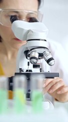 Woman scientist using microscope in laboratory. Microbiology science concept