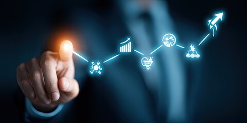 A hand points to a glowing, interconnected series of business icons on a dark background, suggesting growth and strategy