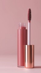 Glamorous close-up of a tube of sparkling red lip product with a fuzzy applicator.