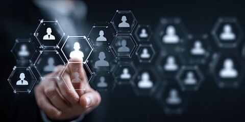 Businessperson's finger points at a network of interconnected user profile icons on a digital interface