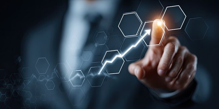 Businessperson's finger interacts with a digital graph showing upward growth