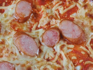 Tokyo,Japan - September 27, 2025: Closeup of a pizza with cheese and sausage toppings