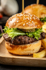 Classic beef burger with pickles and fries