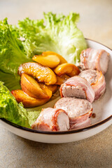 Bacon wrapped chicken with caramelized peaches