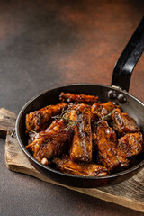 Barbecue pork ribs in rustic pan