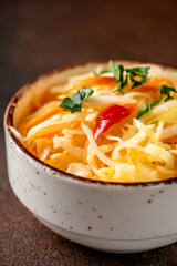 Fresh cabbage salad with carrots and herbs