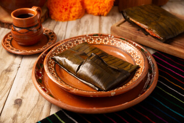 Oaxacan Tamale. Prehispanic dish typical of Mexico and some Latin American countries. Corn dough wrapped in banana leaves. The tamales are steamed.