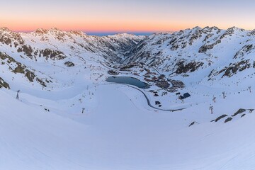Snowy mountain valley at dawn