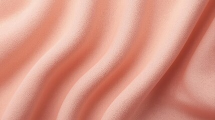 Fototapeta premium Wavy pastel pink fabric presents a delicate and smooth texture with soft folds and subtle shadows perfect for backgrounds and designs.