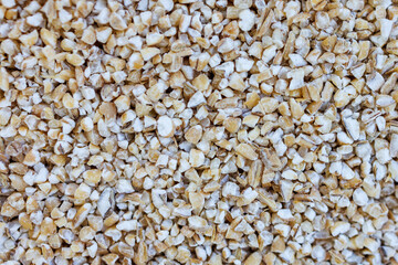 Close Up of Barley Groats Background – Cracked Pearl Barley Grain Texture