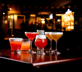 collection of colorful cocktails and drinks with pub on blur background