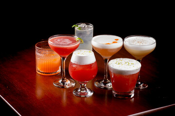 collection of mixology cocktails and colorful drinks with pub in top angle