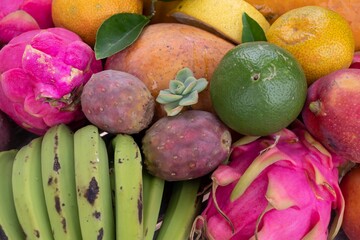 Fresh organic tropical fruits. Papaya, pitaya, mango, bananas, prickly pear, lime, lemon and...