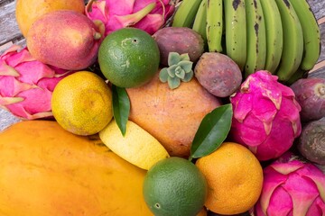 Fresh organic tropical fruits. Papaya, pitaya, mango, bananas, prickly pear, lime, lemon and orange. Healthy lifestyle diet, vegan food rich in antioxidants and natural vitamins.