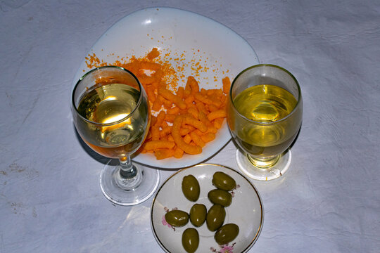 White wine and olives on the table