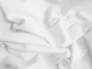 White crumpled fabric background. Wavy cloth texture