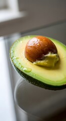 Freshly Sliced Avocado with a Droplet of Water Revealing Its Creamy Texture and Nutty Flavor