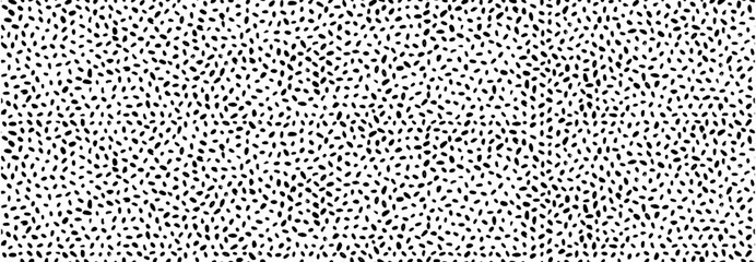 Minimalist irregular tiny polka dot seamless pattern. Hand drawn doodle speckles, blobs and dots background. Doodle texture for seamless baby background, wallpaper or aesthetic playful effect.