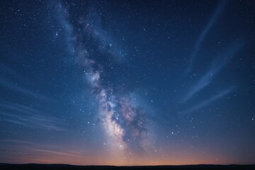 Milky way arch above drifting clouds long exposure night sky tranquil landscape