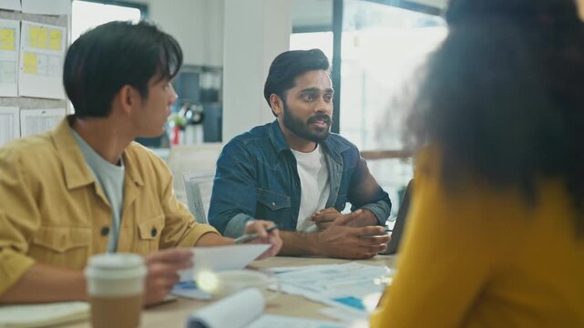 Diverse multiethnic fintech professionals collaborate in agile hackathon workshop, sharing adaptive business strategies through AI-powered big data analytics for exponential growth and convergent