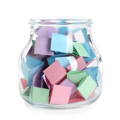 Many colorful paper pieces in glass jar isolated on white