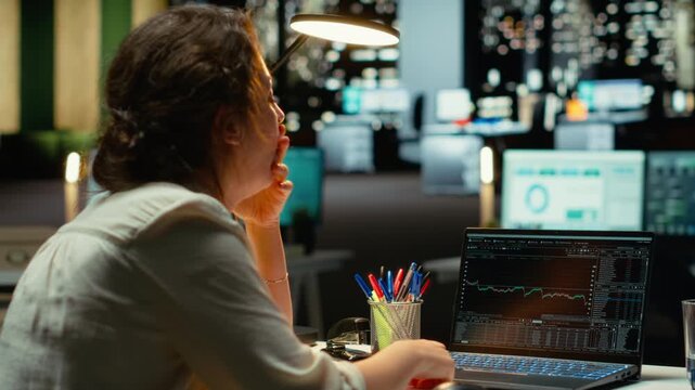 Devastated finance advisor looks at real time money loss and decreasing trends, stock crash causing concern for bankruptcy. Cryptocurrency market fall showcases a financial crisis. Camera B.