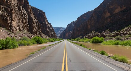 Fototapeta premium Road through canyon landscape with clear sky perspective view