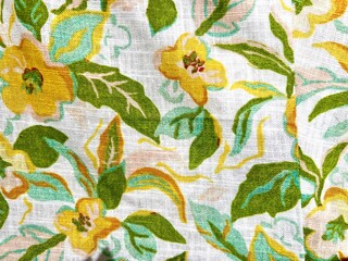 A beautiful floral and leaf motif on cotton fabric, predominantly yellow and green against a white background. Perfect for textures, cards, carpets, and more