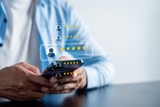 Customer review giving five star reviews using a smartphone, concept of online feedback, user rating, and reputation management in digital marketing and e-commerce.