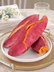 Roasted Sweet Potatoes with Orange Flesh on White Plate - Fresh Healthy Root Vegetables