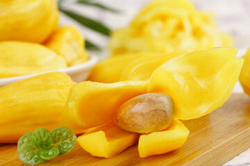 Fresh Hainan Red Pineapple Slices with Golden Honey Flesh on Wooden Board