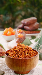 Handmade Jiaxing Zongzi Rice Dumplings with Salted Egg Yolk and Meat Filling in Wooden Bowl