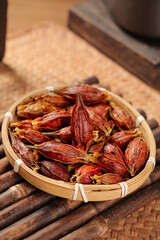 Dried Sichuan Gardenia Fruits in Bamboo Basket - Traditional Chinese Herbal Medicine Ingredient