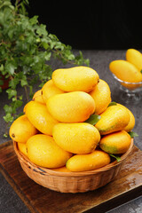 Fresh Hainan Xiaotainong Mangoes in Wicker Basket - Tropical Fruit Harvest Display