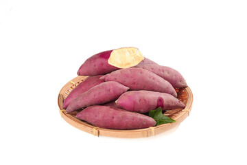 Fresh Purple Sweet Potatoes in Bamboo Basket on White Background