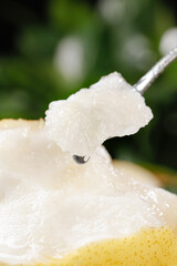 Fresh White Crown Pear Flesh on Spoon - Juicy Fruit Close-up from Hebei