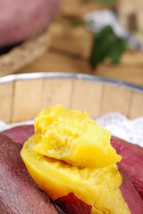 Fresh Yellow Sweet Potato Cut Open Showing Aromatic Fluffy Interior on Wooden Board