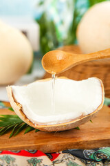 Fresh Coconut Milk Dripping from Wooden Spoon - Tropical Organic King Coconut Extract