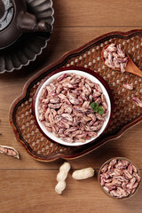 Colorful Striped Kidney Beans and Peanuts in Rustic Kitchen Setting