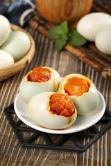 Gaoyou Salted Duck Eggs with Golden Yolks - Traditional Chinese Preserved Eggs on Rustic Wooden Table