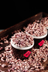 Traditional Dried Beans in Wooden Bowls at Farmers Market Display