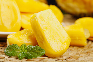 Fresh Yellow Popsicles with Mint on Wooden Board - Summer Frozen Treats