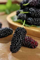 Fresh Black Mulberries on Wood Board - Healthy Organic Berry Fruit Food Photography