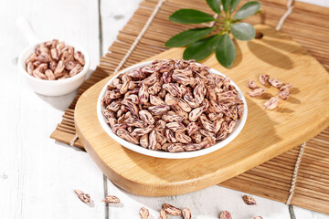 Fresh Pinto Beans in Bowl on Wooden Board - Healthy Organic Legumes for Cooking