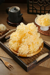 White Snow Fungus Ear Mushrooms in Bamboo Basket Traditional Asian Food Preparation