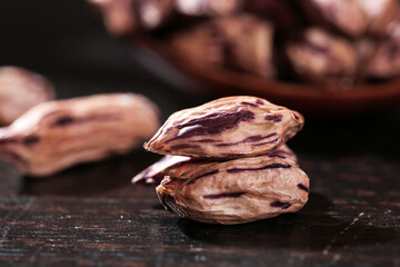 Fresh Walnuts with Natural Brown Shells on Dark Wooden Surface - Healthy Nuts and Kernels Display