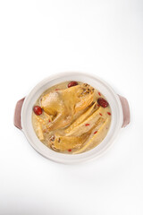 Spring Chicken Consommé Soup with Asparagus and Red Dates in Traditional Ceramic Pot